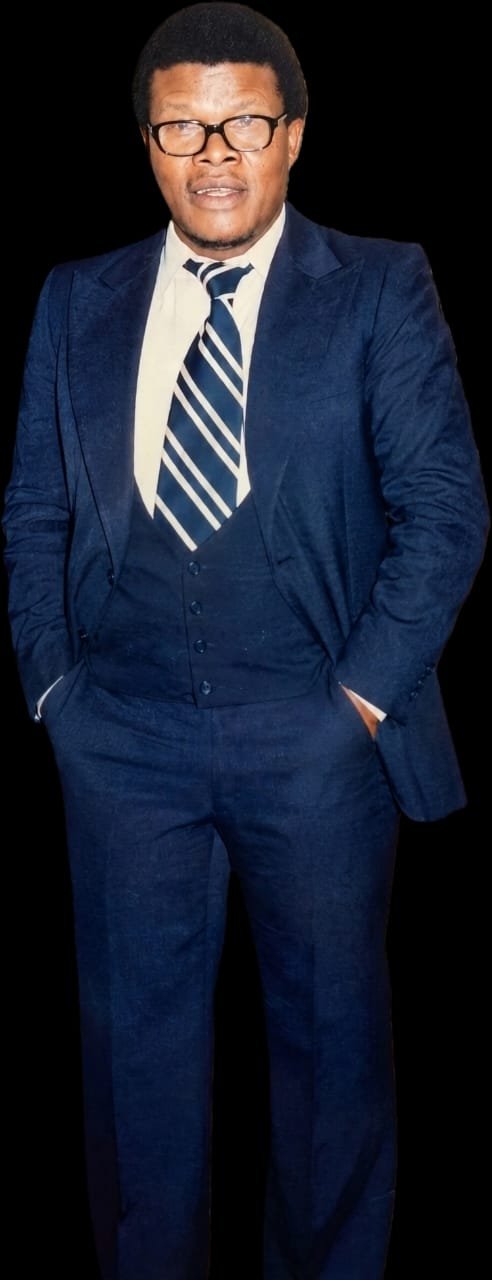 In a navy suit
